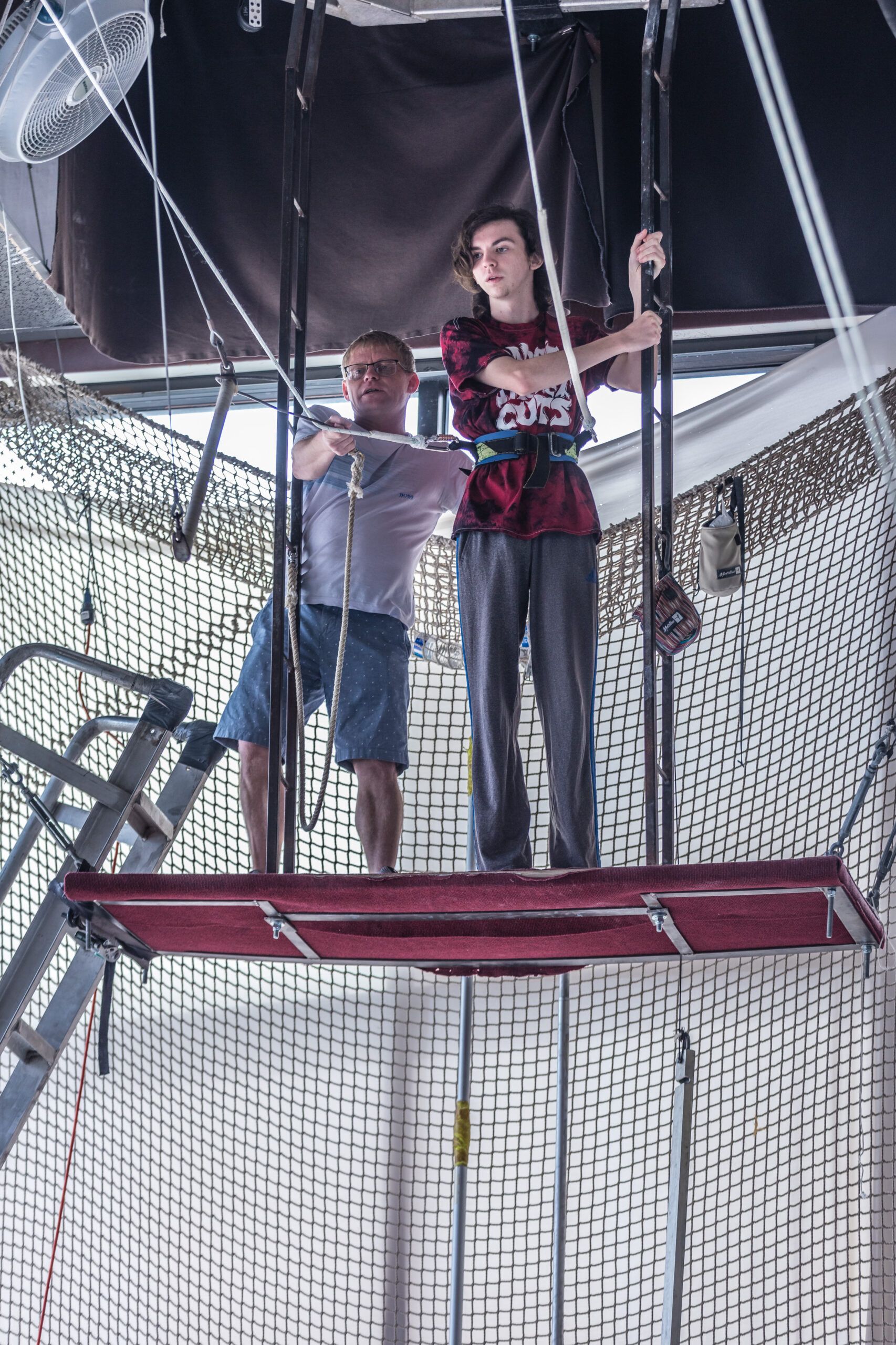 Coach on the flying trapeze rig at Orlando Circus School