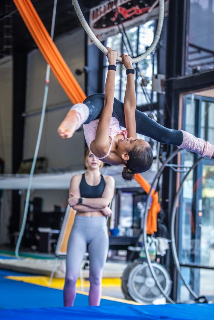 Child on aerial apparatus during a kids class at Orlando Circus School