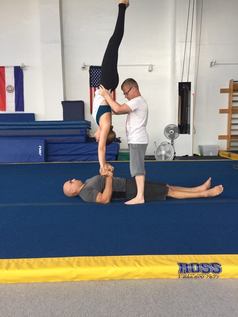 Coach working with a student at Orlando Circus School